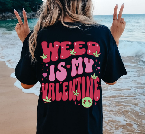 a woman standing on a beach with her hands in the air